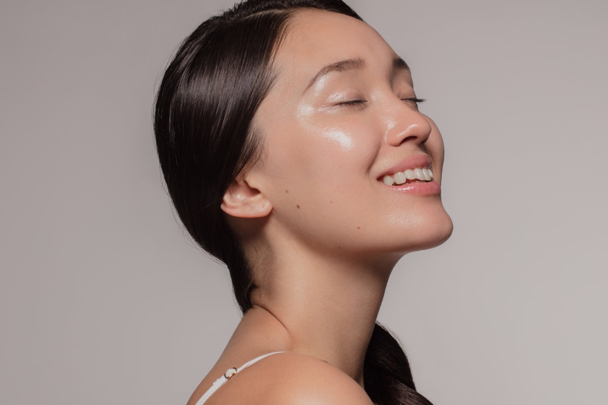 female with great skin smiling