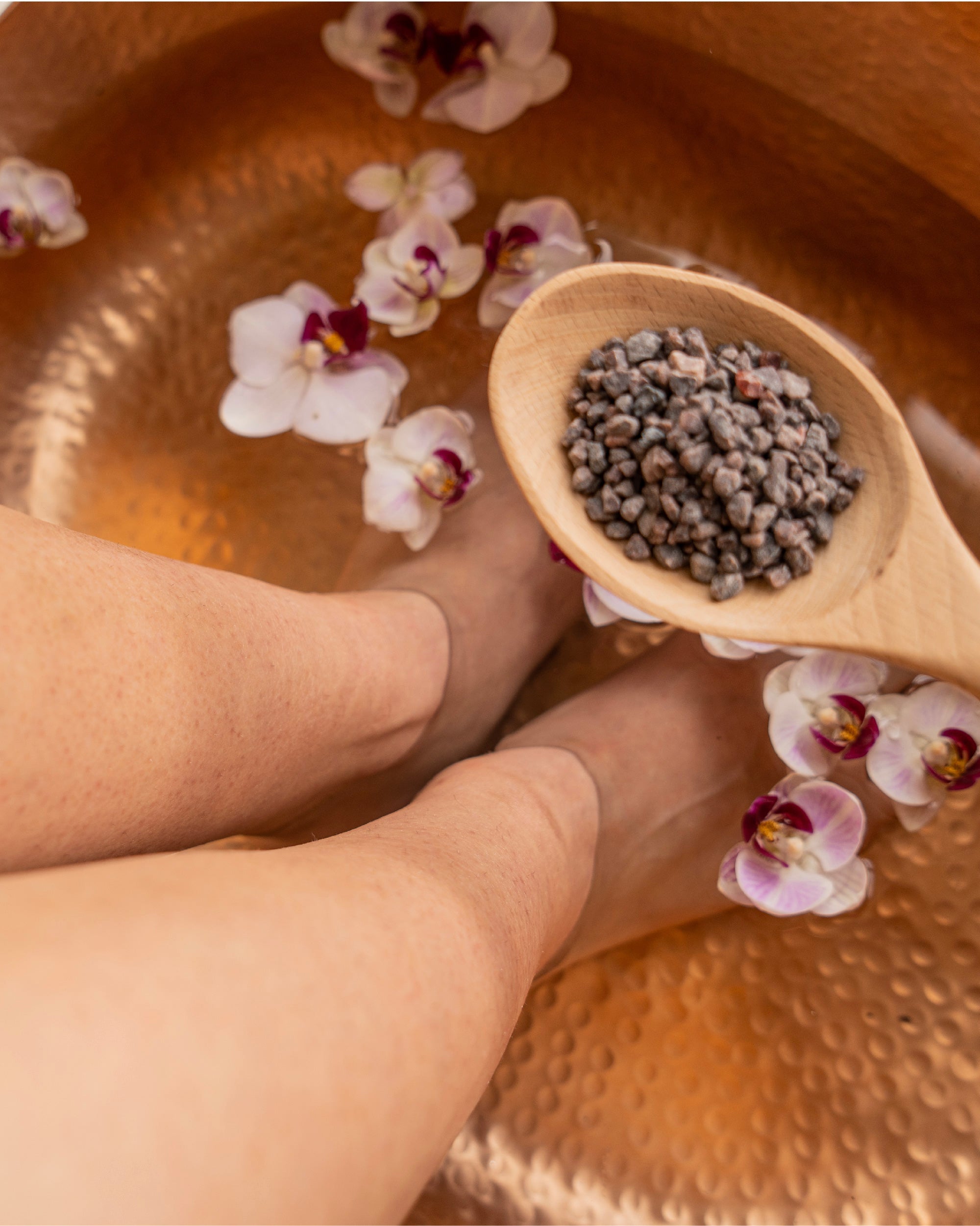 female has foot bath with bathtime mineral salts