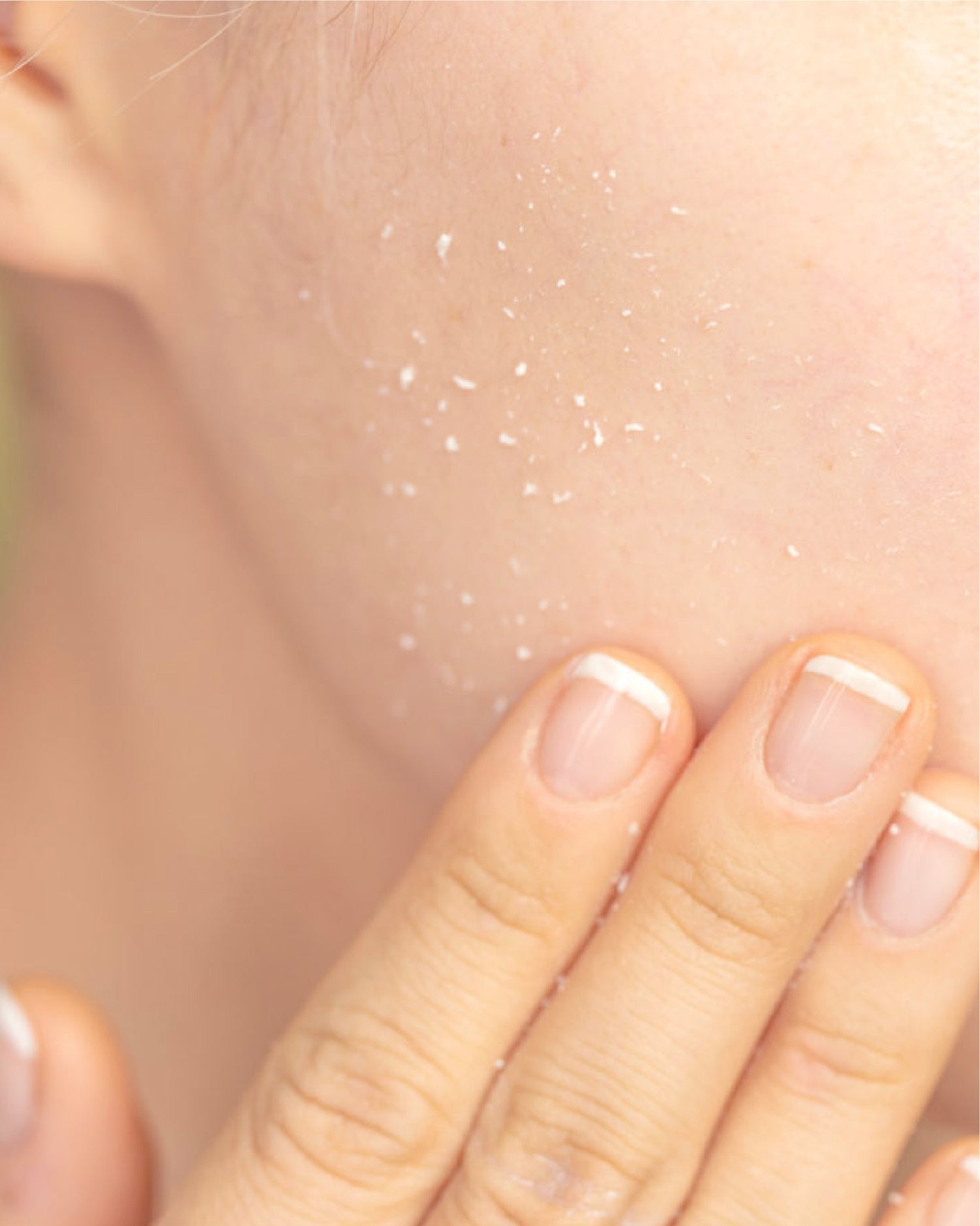 gentle exfoliator reacts to dead skin cells and turns to white beads on female face